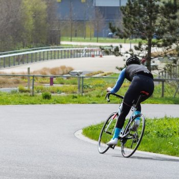Man riding a bike on the road
